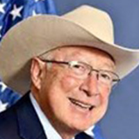 headshot of man with cowboy hat