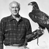 black and white picture of man holding a bird