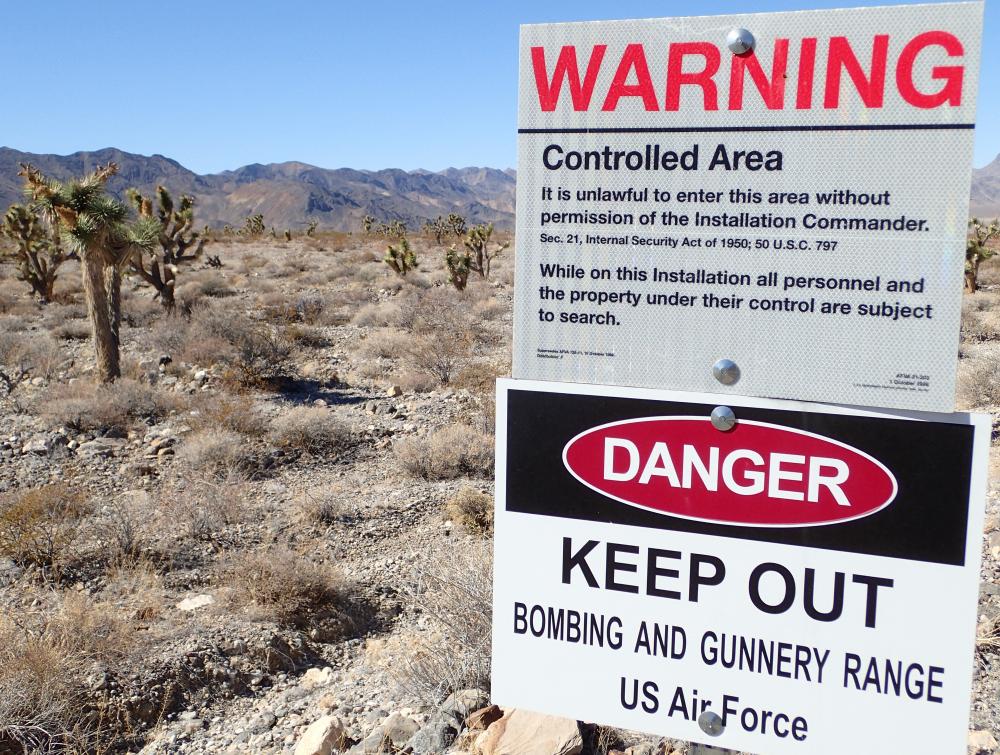 Sign prohibits public entry at Air Force bombing and gunnery range.