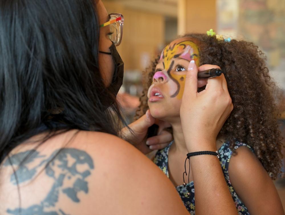 person painting kids face