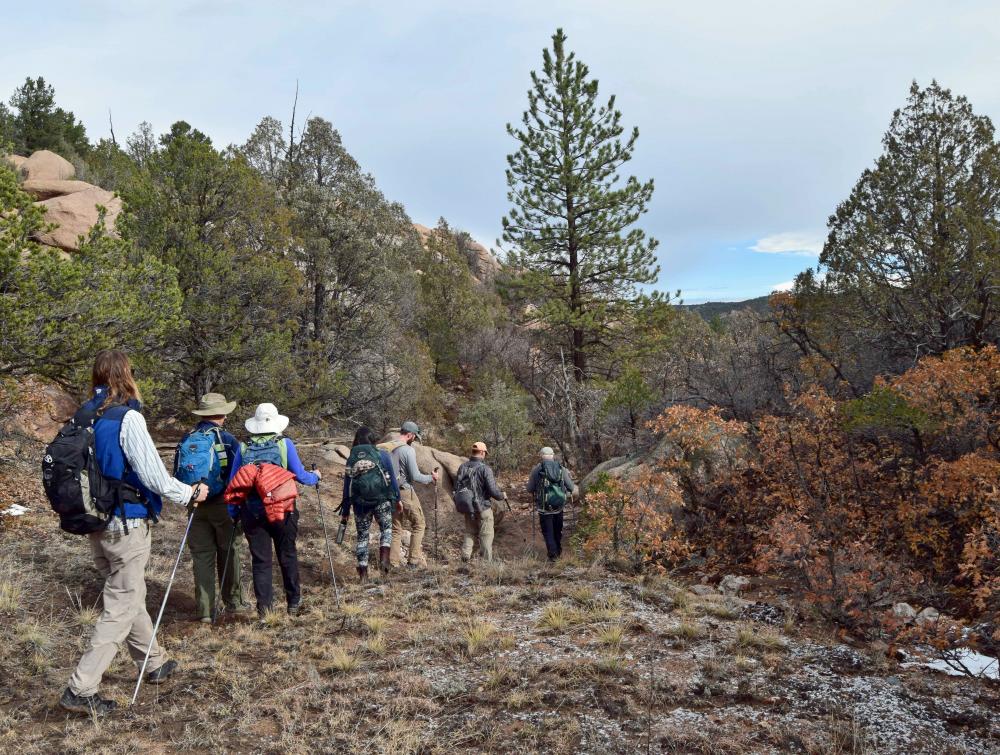 Group hiking McIntyre Hills in Colorado