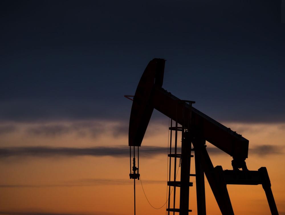dark outline of oil rig in the sunset in Pawnee National Grasslands, CO