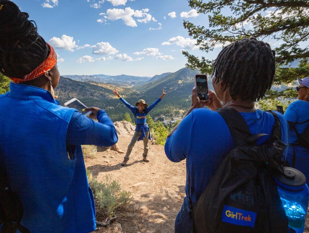Kids taking a joyful photo of a friend in Rocky Mountain NP, CO