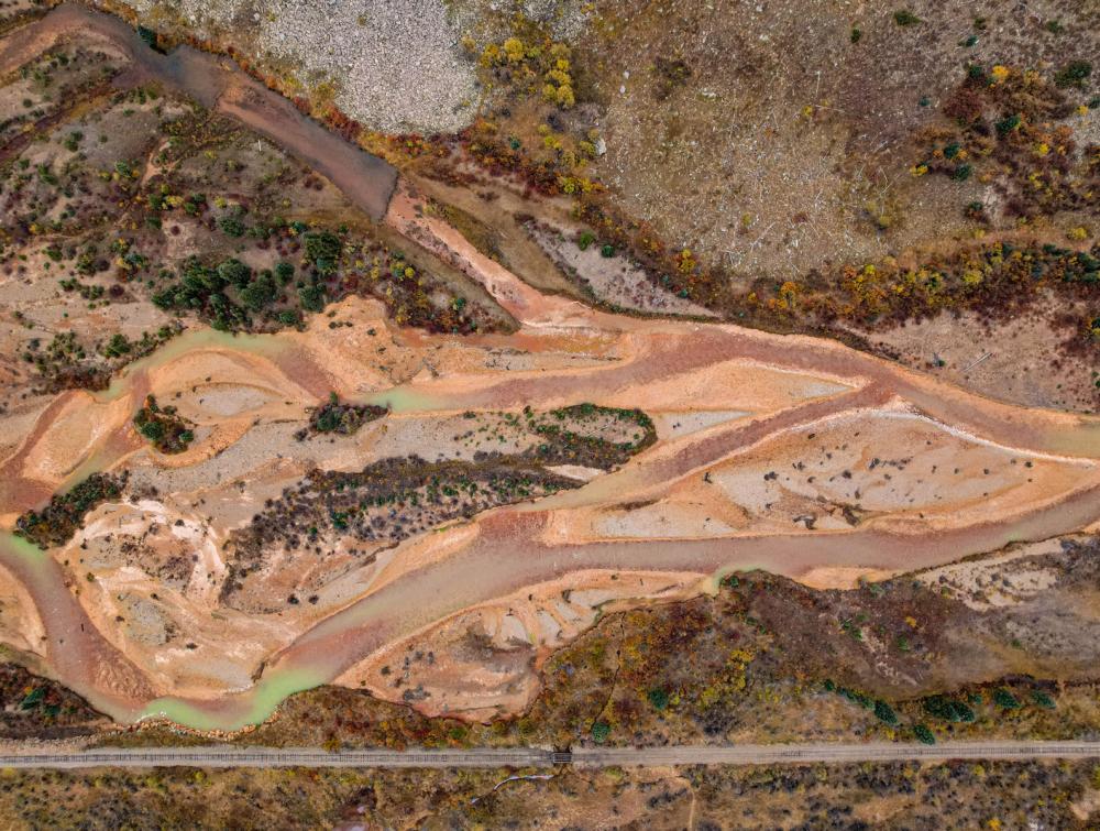 Aerial view of waterway clouded with pollution