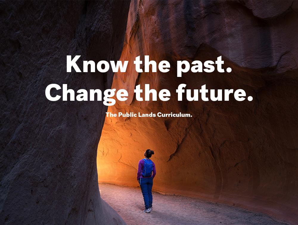 A woman stands below text that reads "Know the past. Change the future. The Public Lands Curriculum."