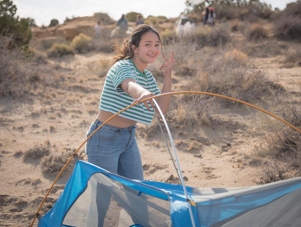 Girl camping in Ah-Shi-Sle-Pah Wilderness Study Area, New Mexico