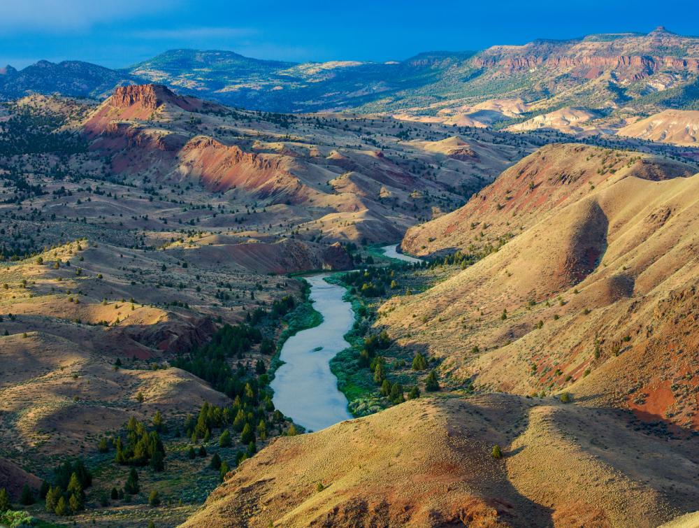 River winding through a valley in a mountainous high desert landscape 