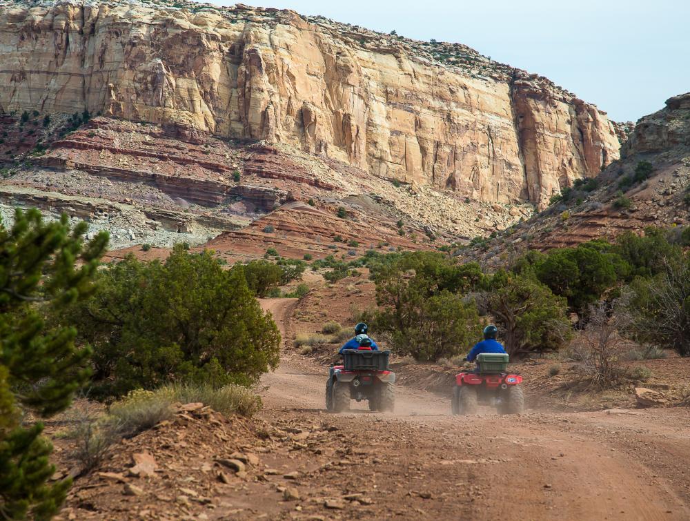 OHV riders on a desert road