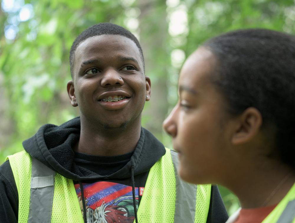 teenagers smiling surrounded by nature