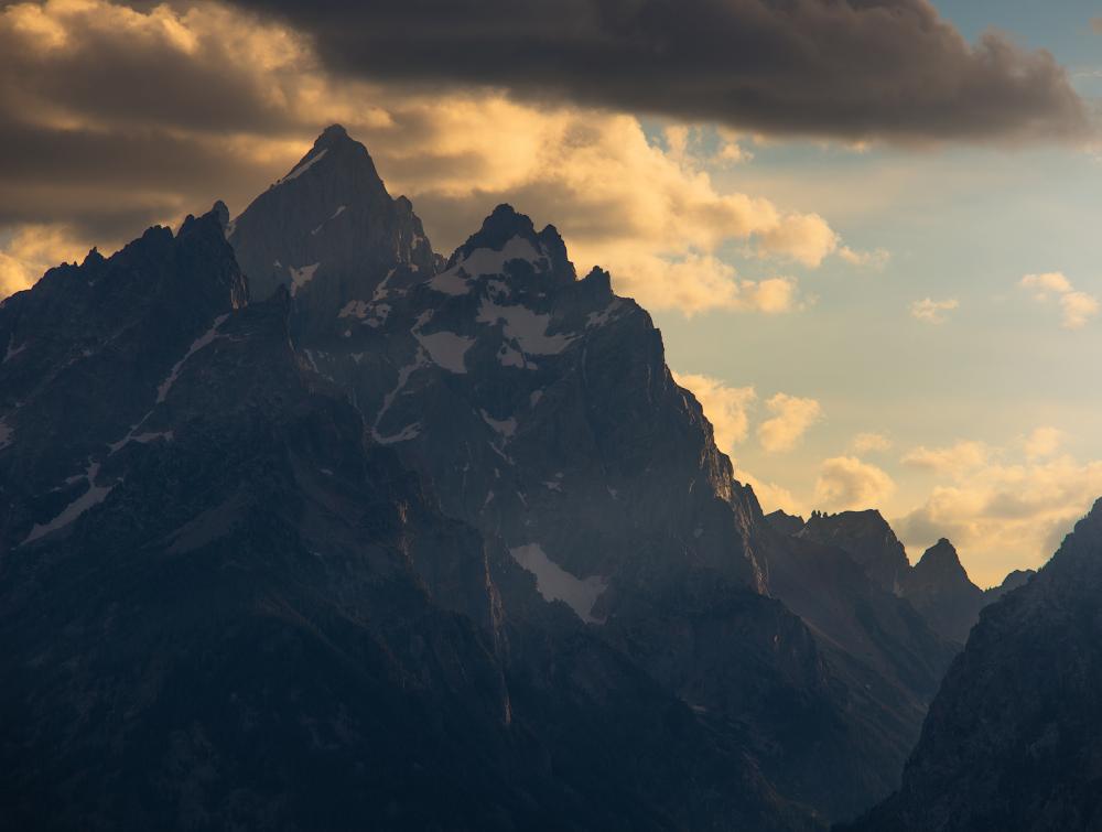 Mountain with sun setting behind it, Wyoming