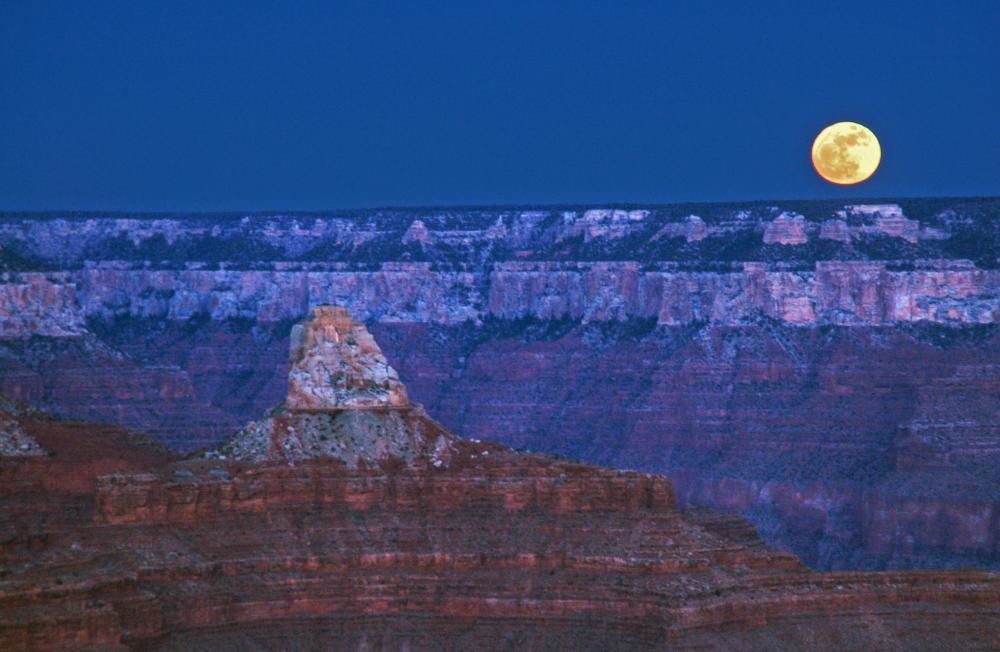 full moon over canyons