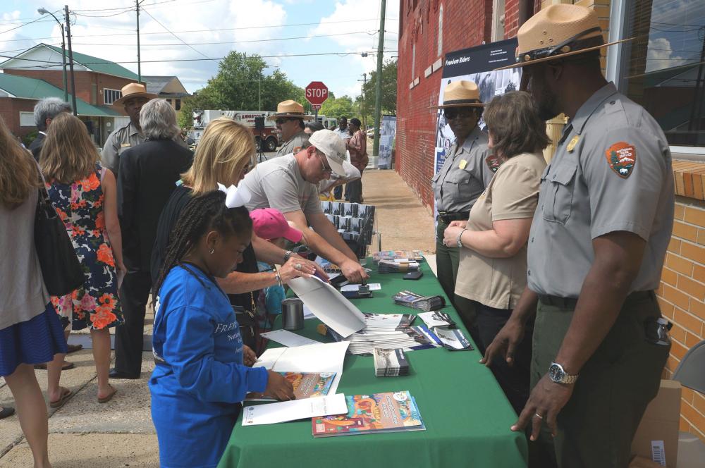 Visitors at information desk at Freedom Riders National Monument, Alabama