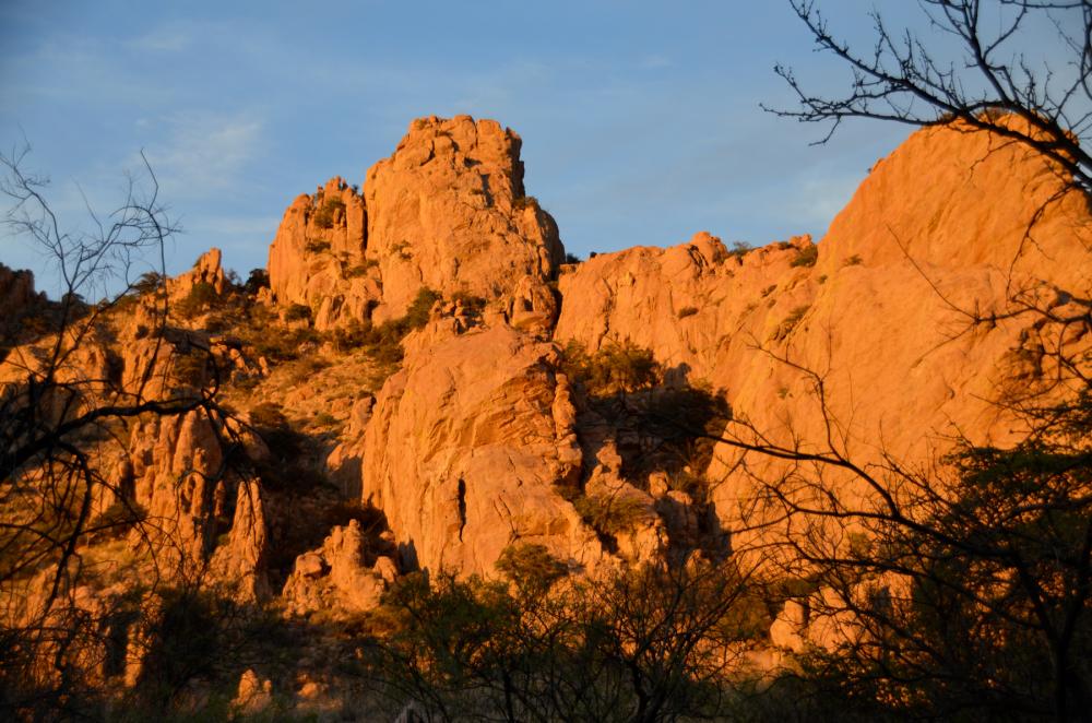 Orange mountains and boulders in desert landscape, Coronado National Forest, Arizona