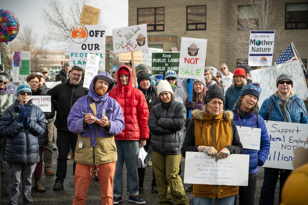 protesters with signs that say protect public lands