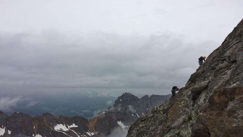 Climbers along the southwest ridge route near the top of Mt. Sneffels in the San Juan Mountains, Colorado