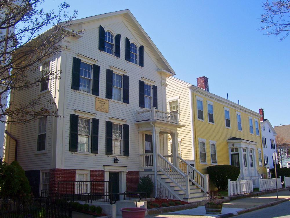 Row of 19th Century houses. On nearest house there is a sign reading: Nathan & Polly Johnson House 