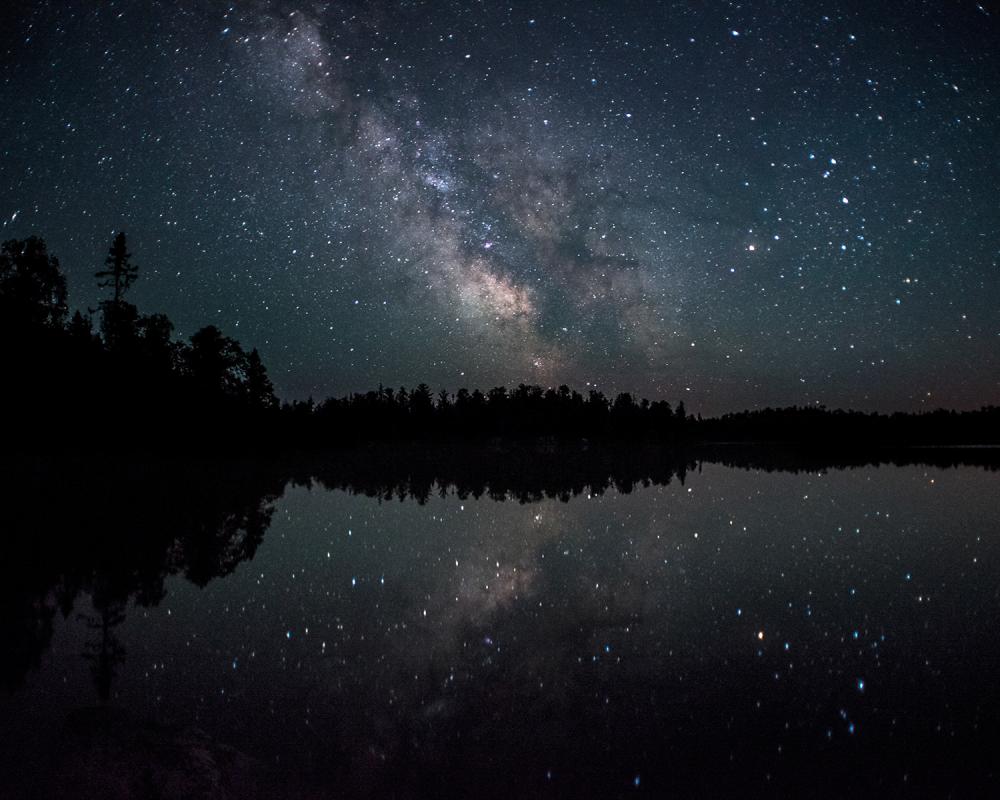 starry sky over lake