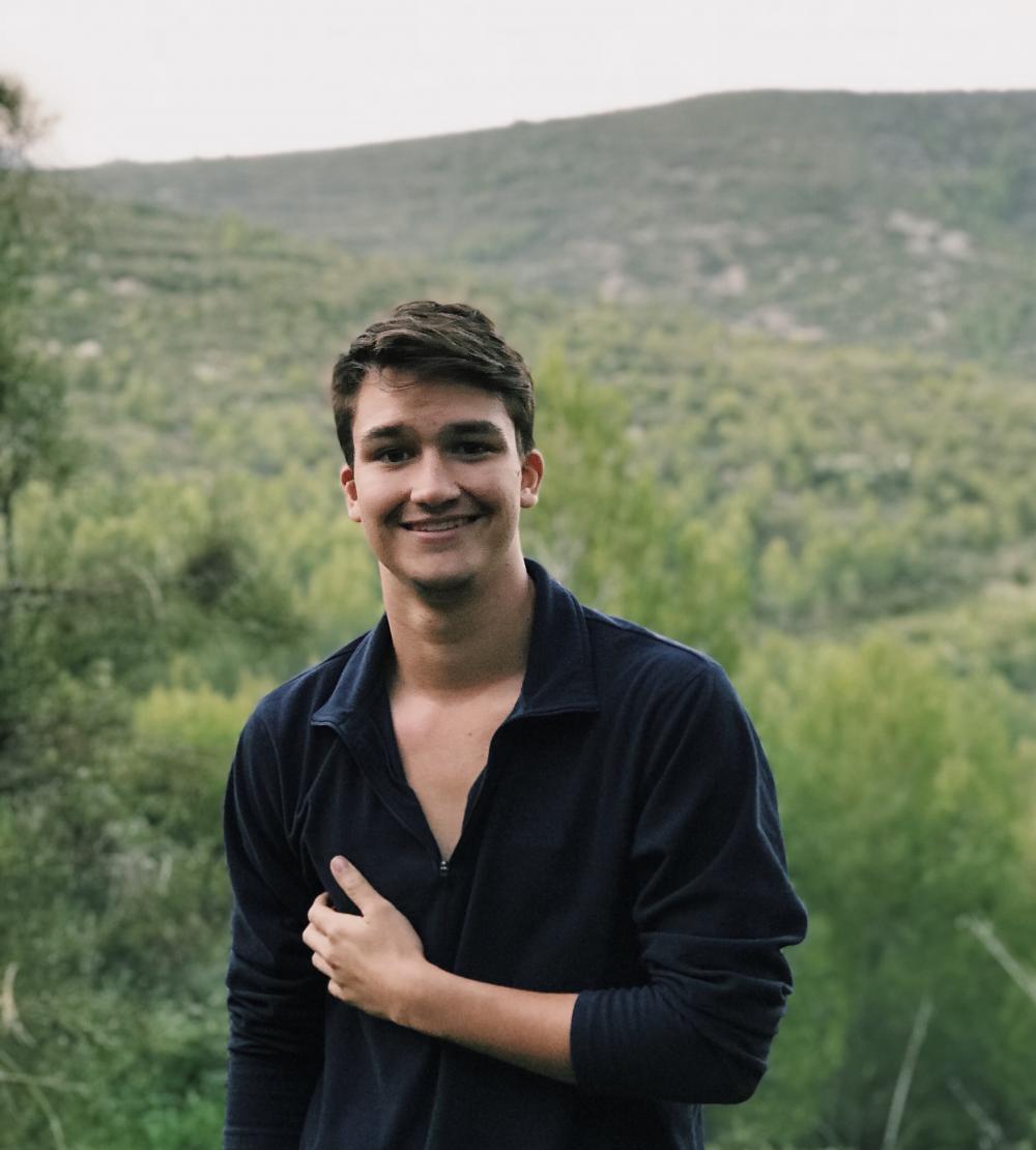 Matt, standing in front of a mountain