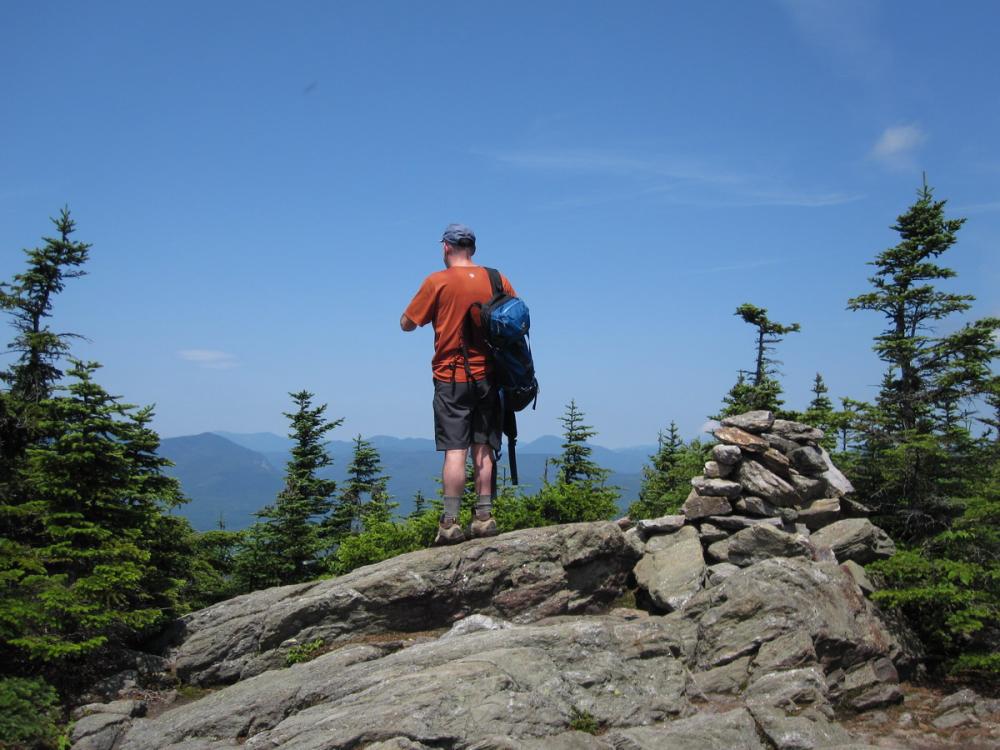 Hiker on Sandwich Mountain within the Sandwich Range Wilderness, New Hampshire Hiker on Sandwich Mountain within the Sandwich Range Wilderness, New Hampshire
