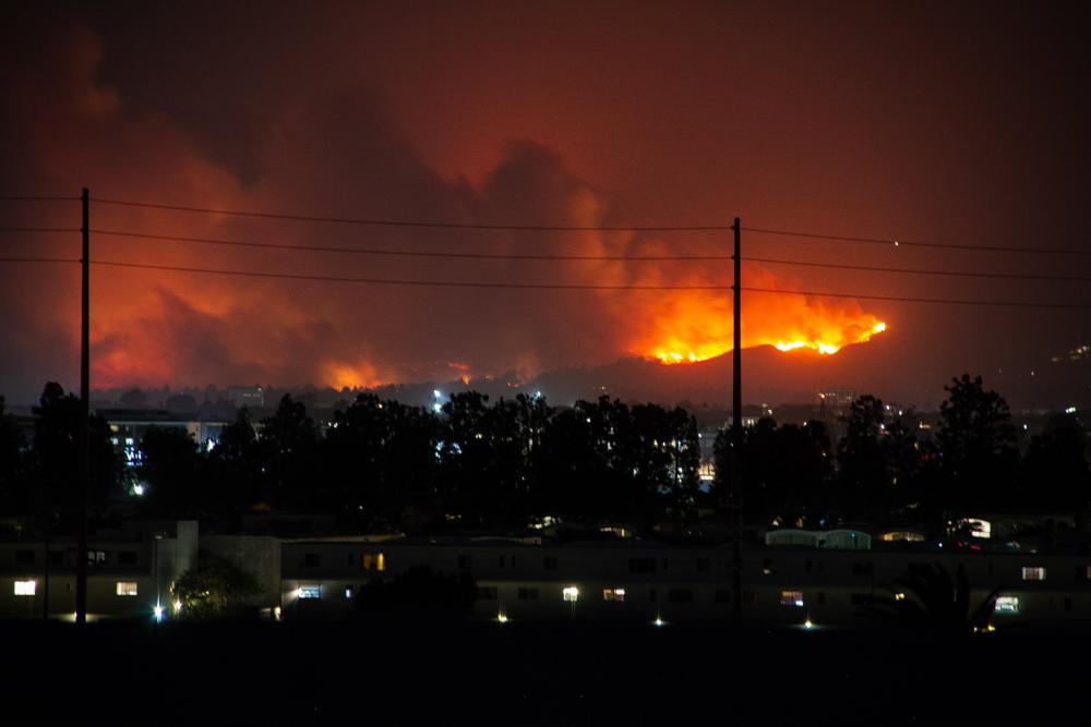 fire over hill in LA