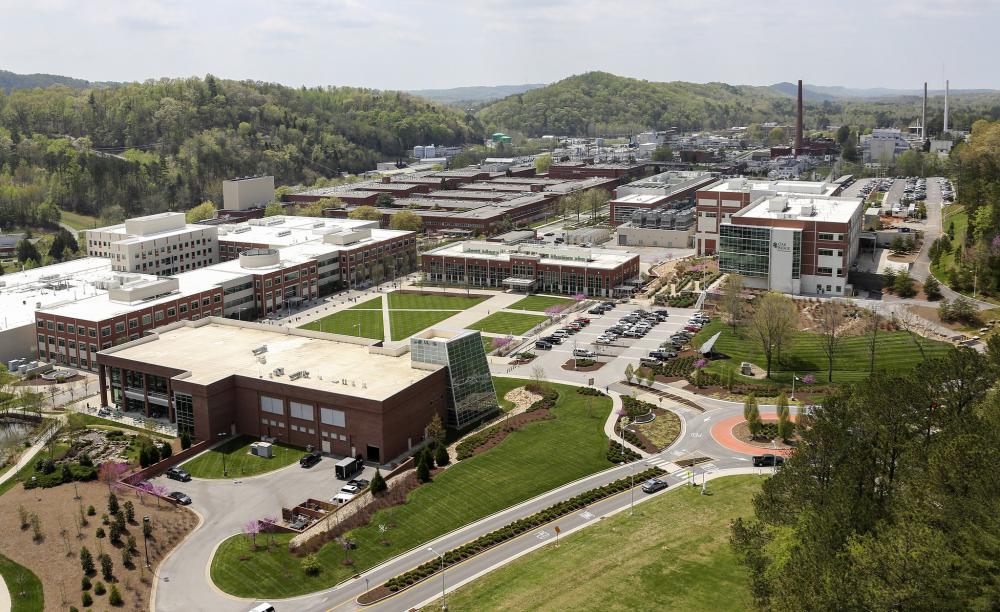 Aerial view of research campus surrounded by trees