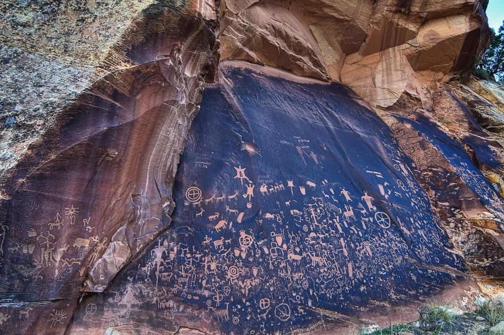 Etched petroglyphs on sandstone at Newspaper Rock in Bears Ears National Monument, Utah