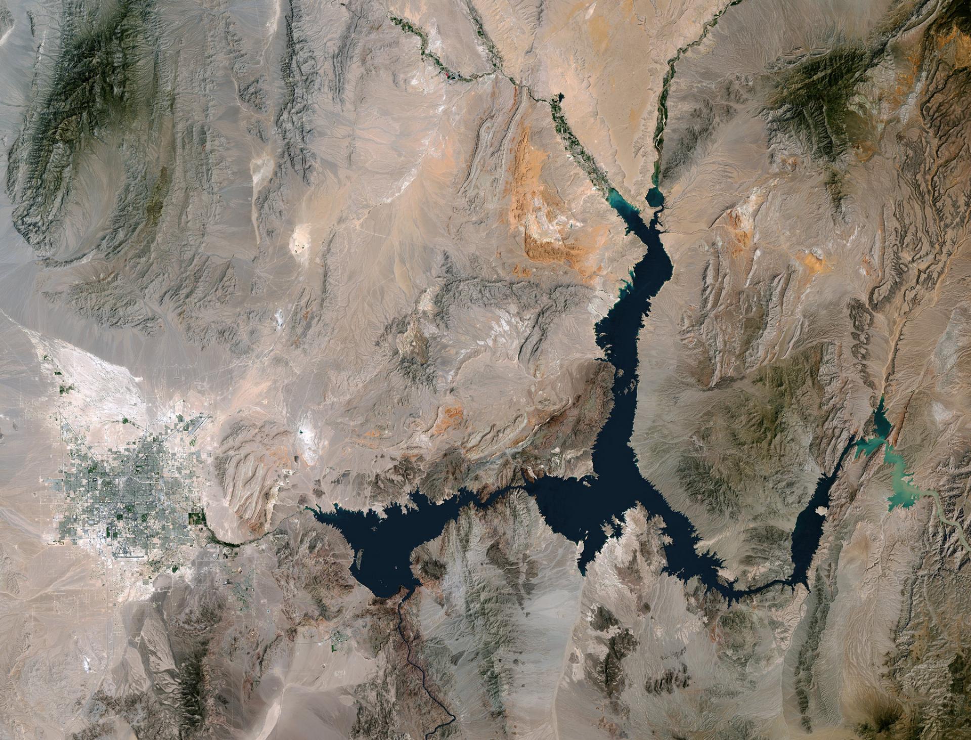 Aerial view of Lake Mead (dark blue jagged shapes) and surrounding landscape from May 23, 2016 NASA image of Lake Mead using Landsat data from May 15, 1984