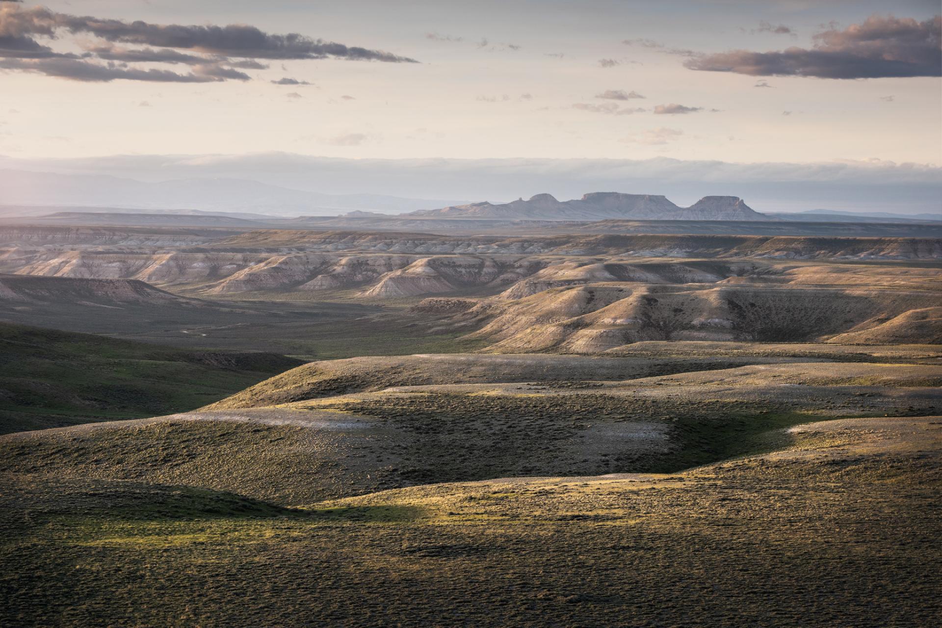 Rolling hills and rocky buttes in the Northern Red Desert, Wyoming