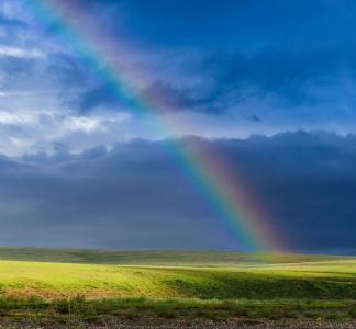 Rainbow across the blue sky in the Arctic National Wildlife Refuge.