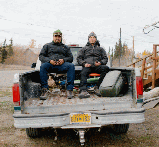 Filmmaker and Navajo activist Len Necefer, left, and Navajo activist Aaron Mike, right, visit Gwichyaa Zhee (Fort Yukon), Alaska