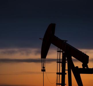 dark outline of oil rig in the sunset in Pawnee National Grasslands, CO