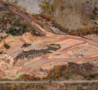 Aerial view of waterway clouded with pollution