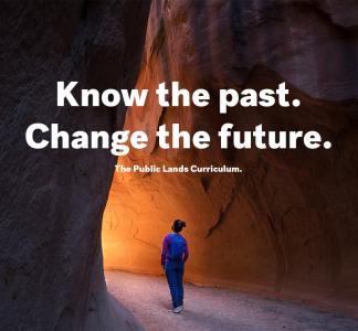 A woman stands below text that reads "Know the past. Change the future. The Public Lands Curriculum."