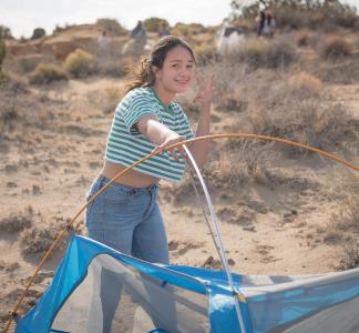 Girl camping in Ah-Shi-Sle-Pah Wilderness Study Area, New Mexico