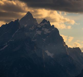 Mountain with sun setting behind it, Wyoming