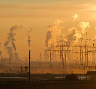 Pollution and power lines on an orange sky.