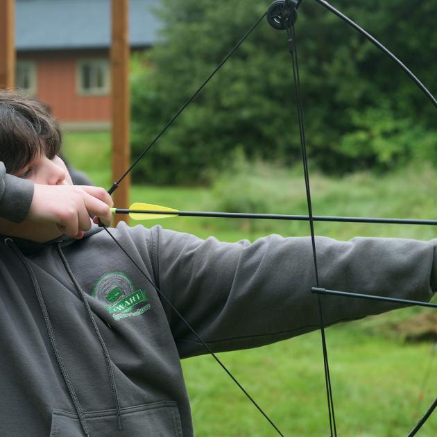 kid doing bow and arrow