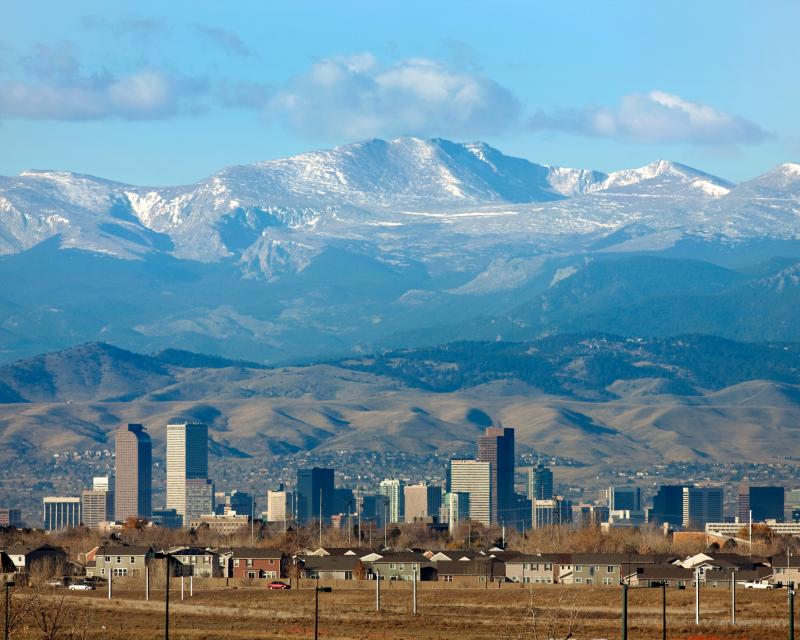 Snowy Mt. Evans behind city.