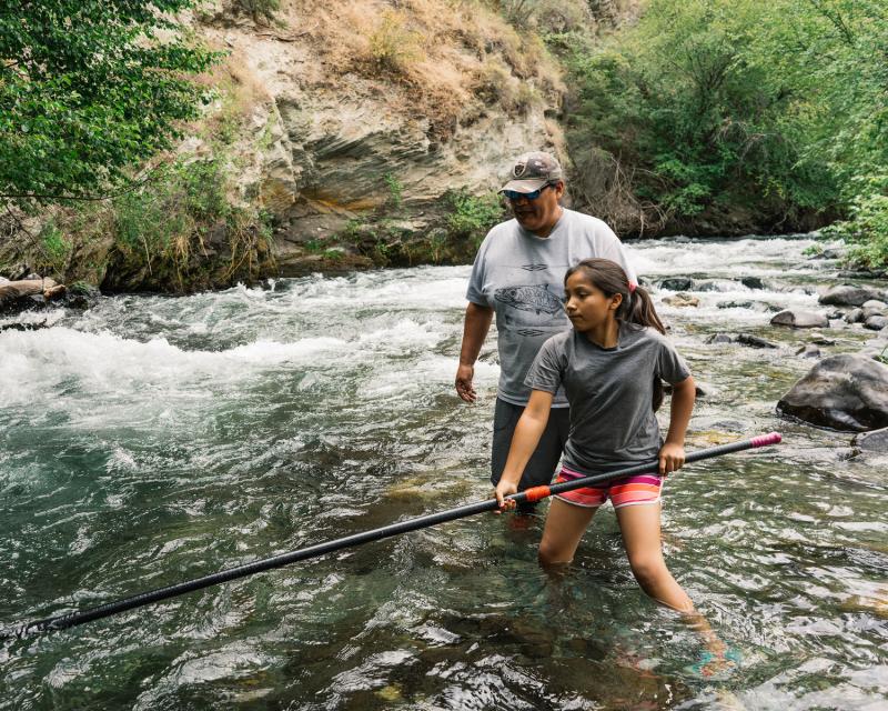 Man and girl fishing in Hells Canyon Wilderness, Idaho.