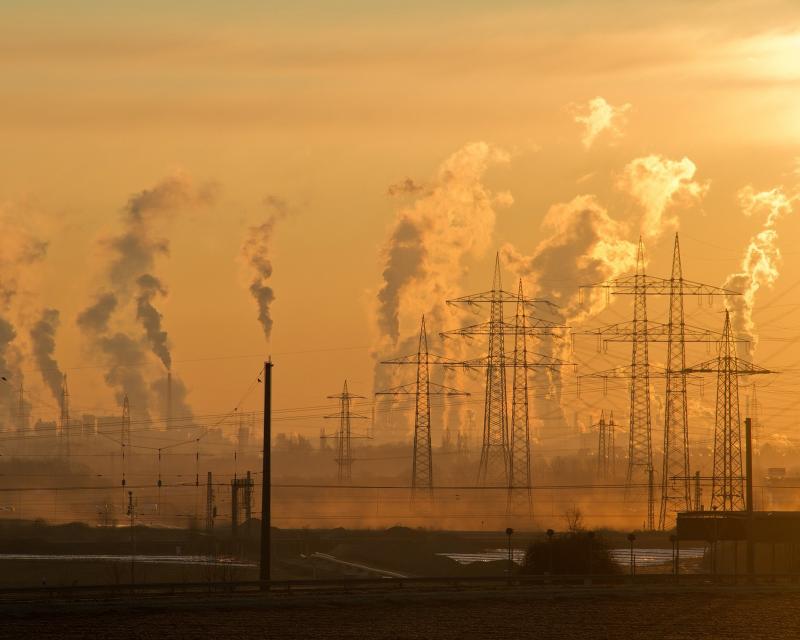 Pollution and power lines on an orange sky.