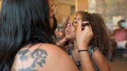 person painting kids face